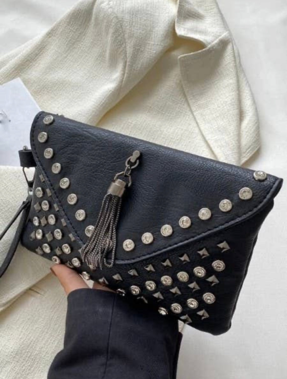 Studded store clutch bag